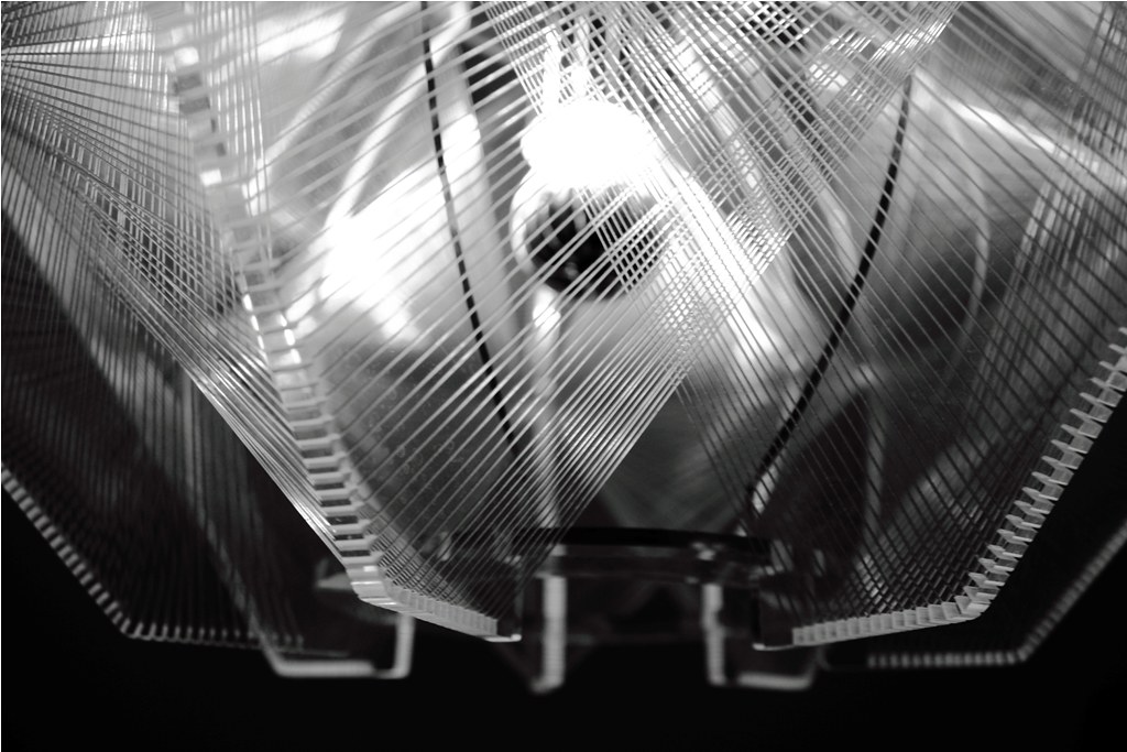 Abstract detail of intersecting metallic lines with warm light