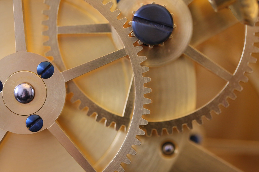 Macro photograph of interlocking metal gears, symbol of automation machinery
